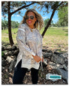Woman wearing a camo classic crew loose fit sweatshirt- blakeley