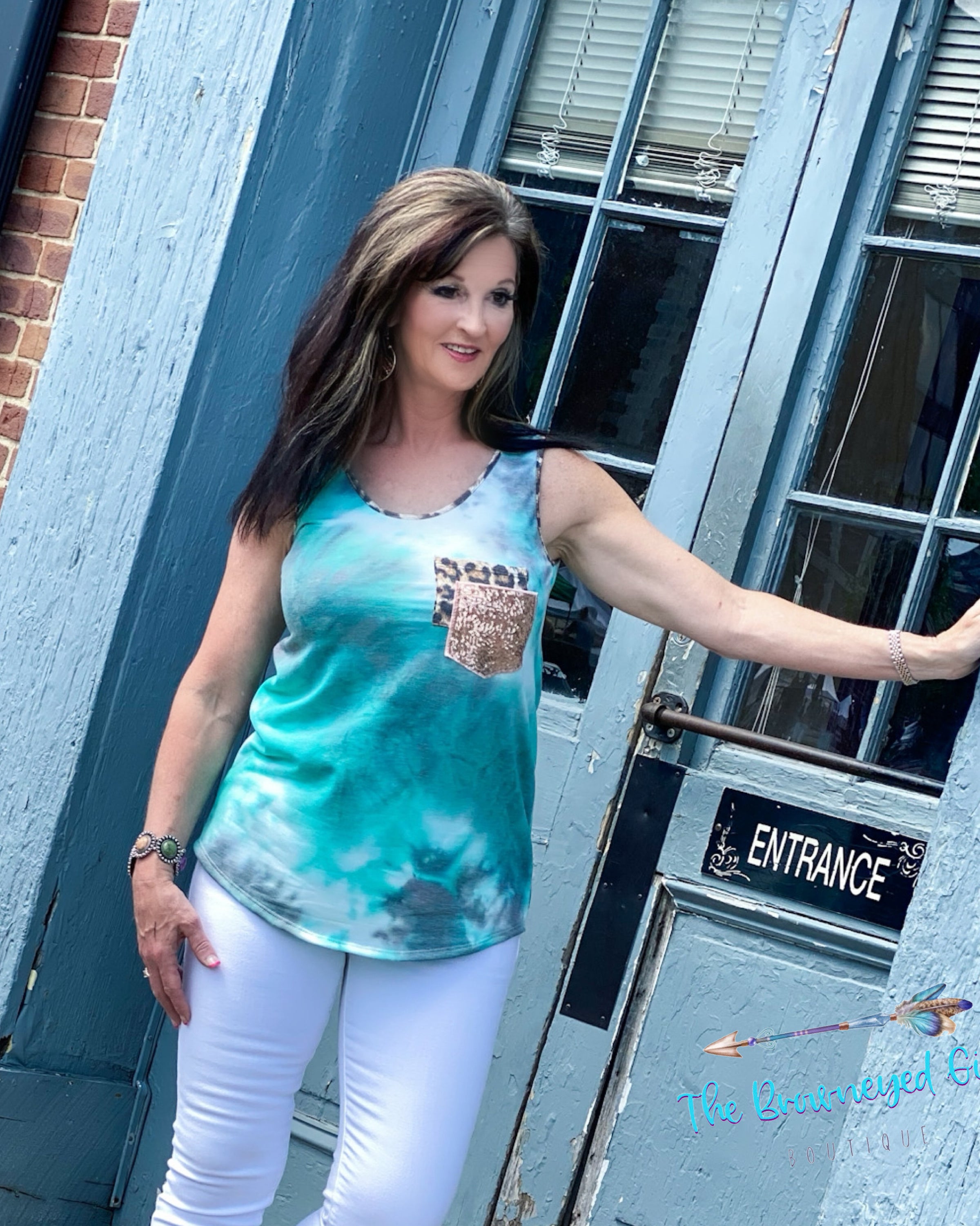 Woman wearing a jade tie-dye tank with a crew neckline. Double front pocket's sequin and leopard. This tank is ultra comfy fits true to size. Model is a size 7 38" bust wearing a medium. 