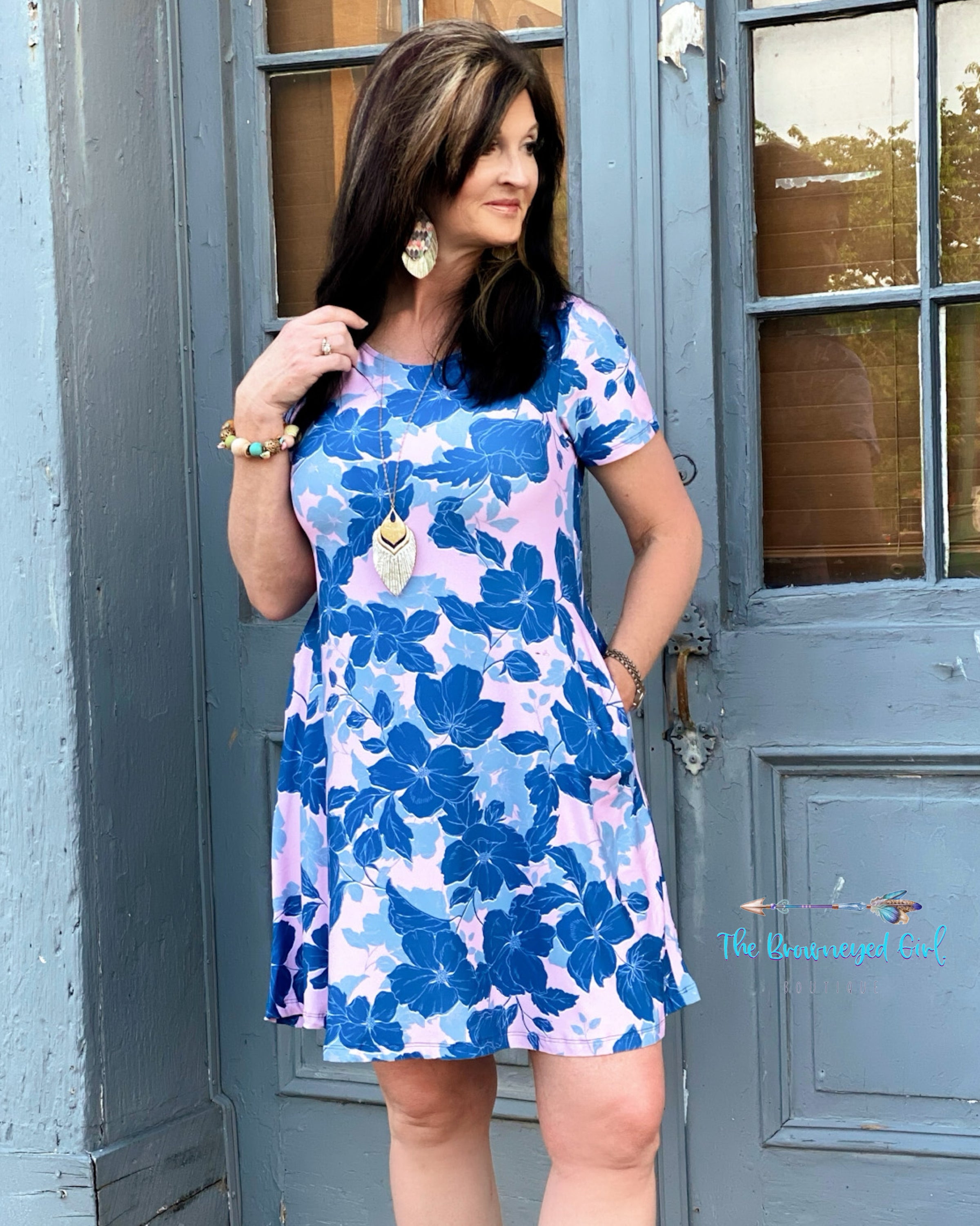 Woman Wearing Blue Floral  Print Above The Knee  Dress. Short Sleeve And The Cute Fit To Flare. This Dress Fits True To Size