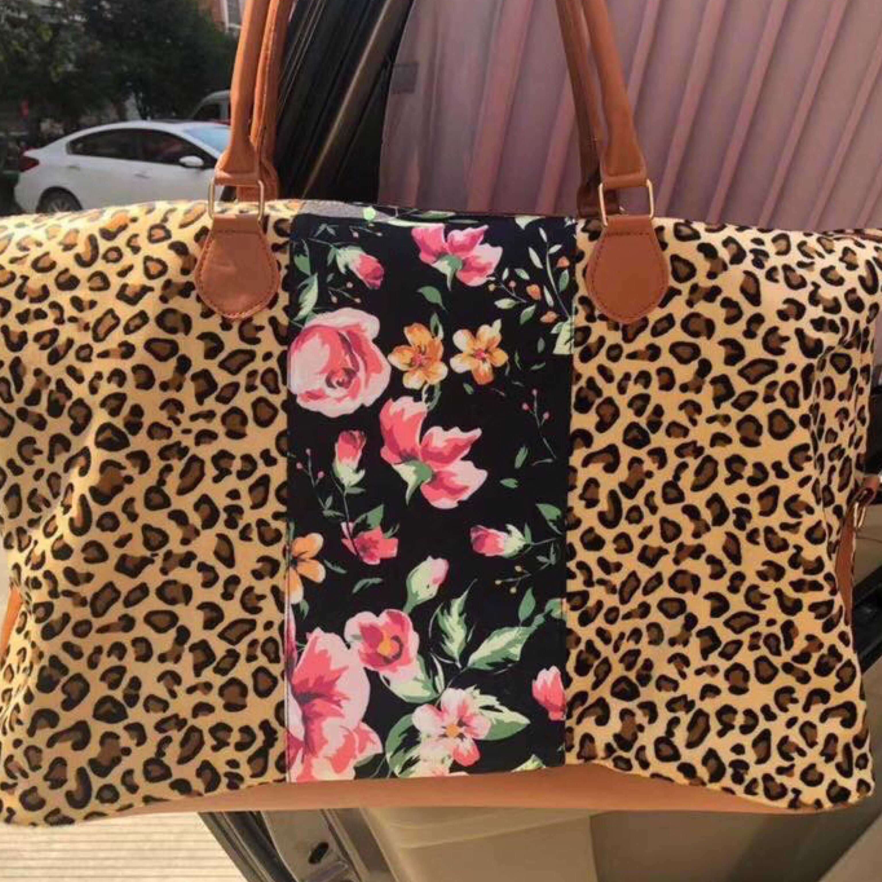 Leopard and store floral weekender bag