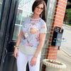 Woman Wearing Grey Floral Short Sleeve Top With Double Front Pockets. Stripe and Sequin Fits True To Size USA MADE 