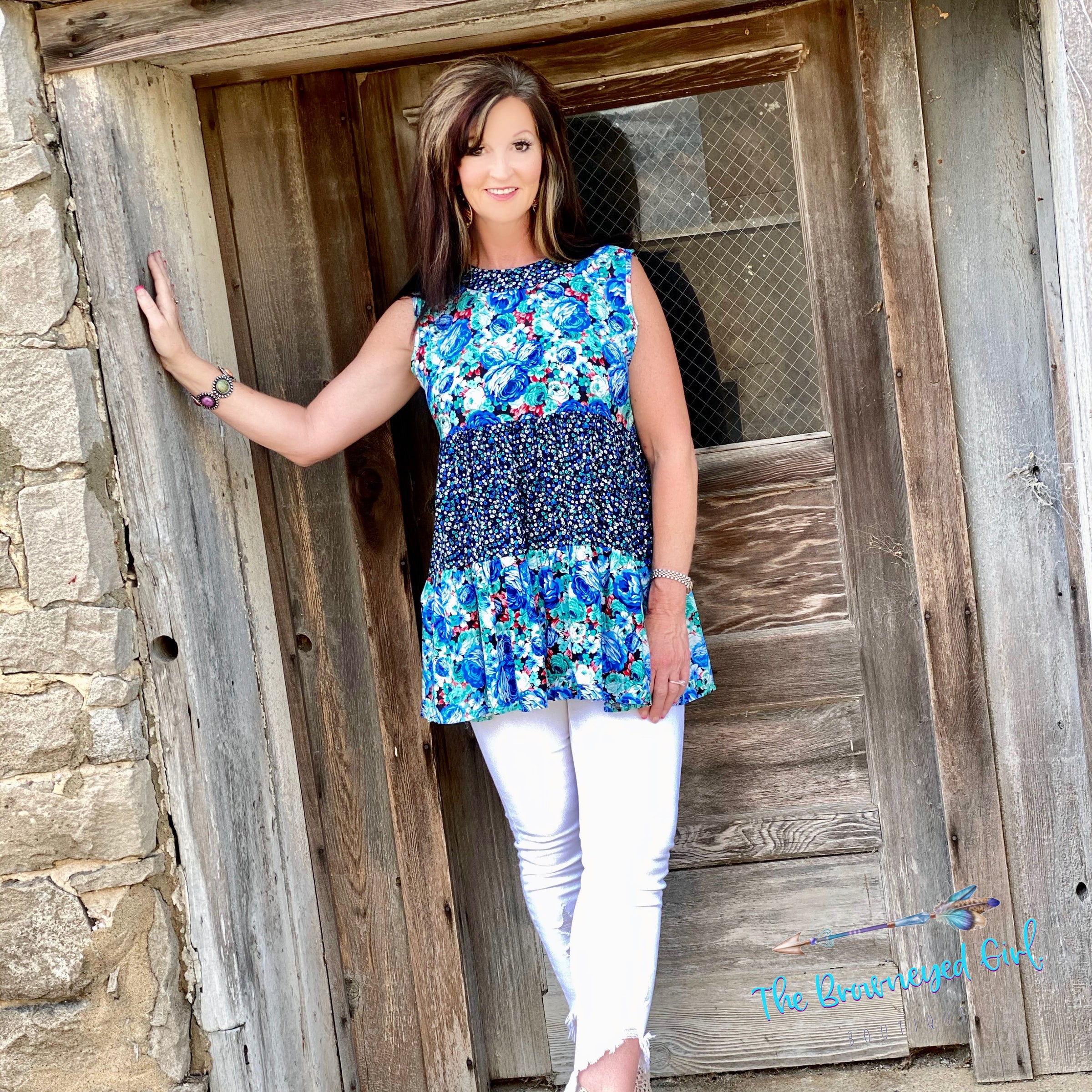 Woman Wearing Multi Color Floral Print Baby Doll Ruffle Layer Tank Tunic