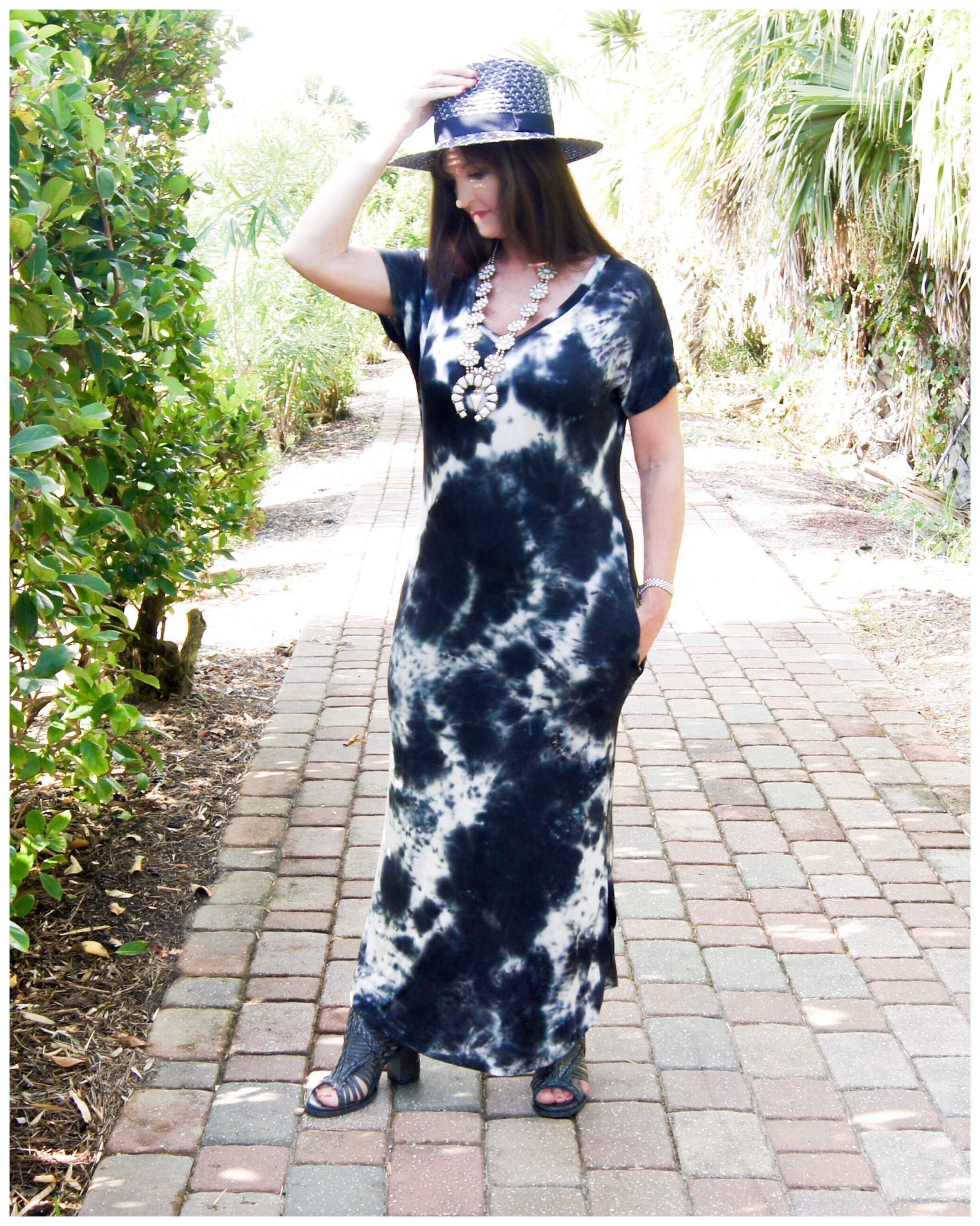 Midnight Magic Tie-Dye Maxi Woman wearing a ivory and dark navy tie-dye maxi dress short sleeve with a v-neck line and side pockets. Material is ultra soft and stretchy with side slits but not to far. - TheBrownEyedGirl Boutique
